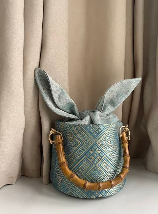 Zhuang | Loom Cute Rabbit Ear Zhuang Brocade Bucket Bag with Bamboo Handle Intangible Cultural Heritage Fashion Item