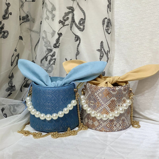 Handmade Zhuang Brocade Bunny-Ear Bucket Bag | Artisan-Crafted Ethnic Crossbody Bag with Pearl Accent