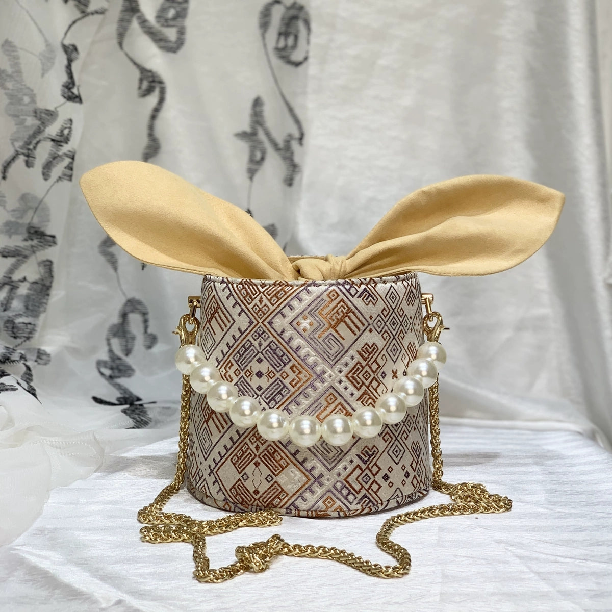 Handmade Zhuang Brocade Bunny-Ear Bucket Bag | Artisan-Crafted Ethnic Crossbody Bag with Pearl Accent