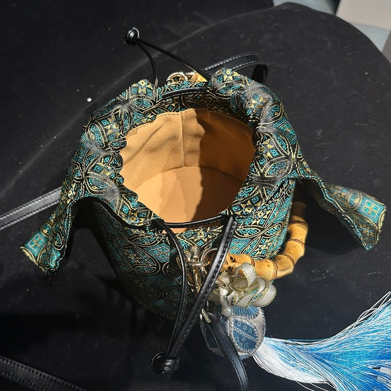 Handmade Zhuang Brocade Mini Bucket Bag with Bamboo Handle | Artisan Crafted Ethnic Crossbody Bag with Blue Tassel Charm