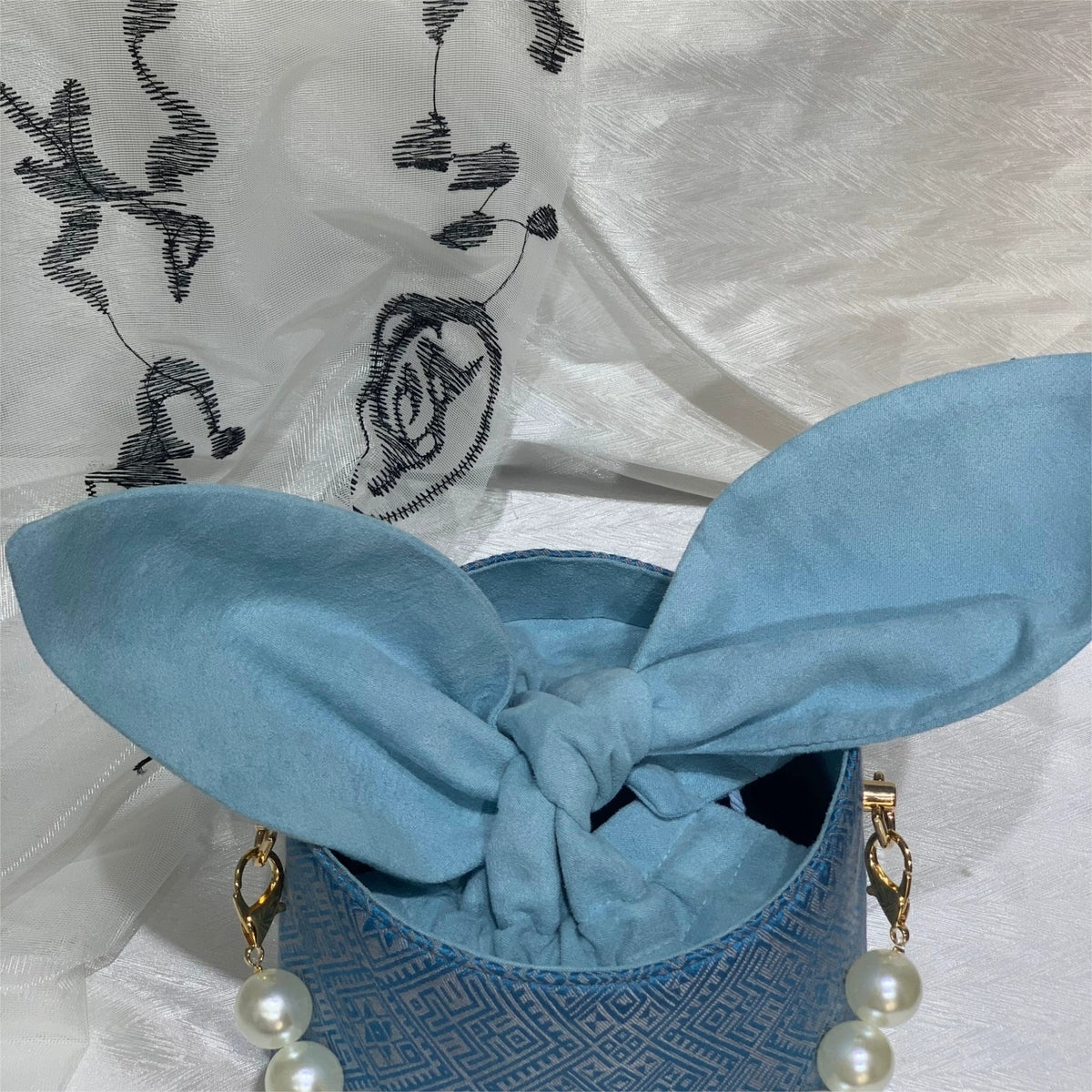 Handmade Zhuang Brocade Bunny-Ear Bucket Bag | Artisan-Crafted Ethnic Crossbody Bag with Pearl Accent