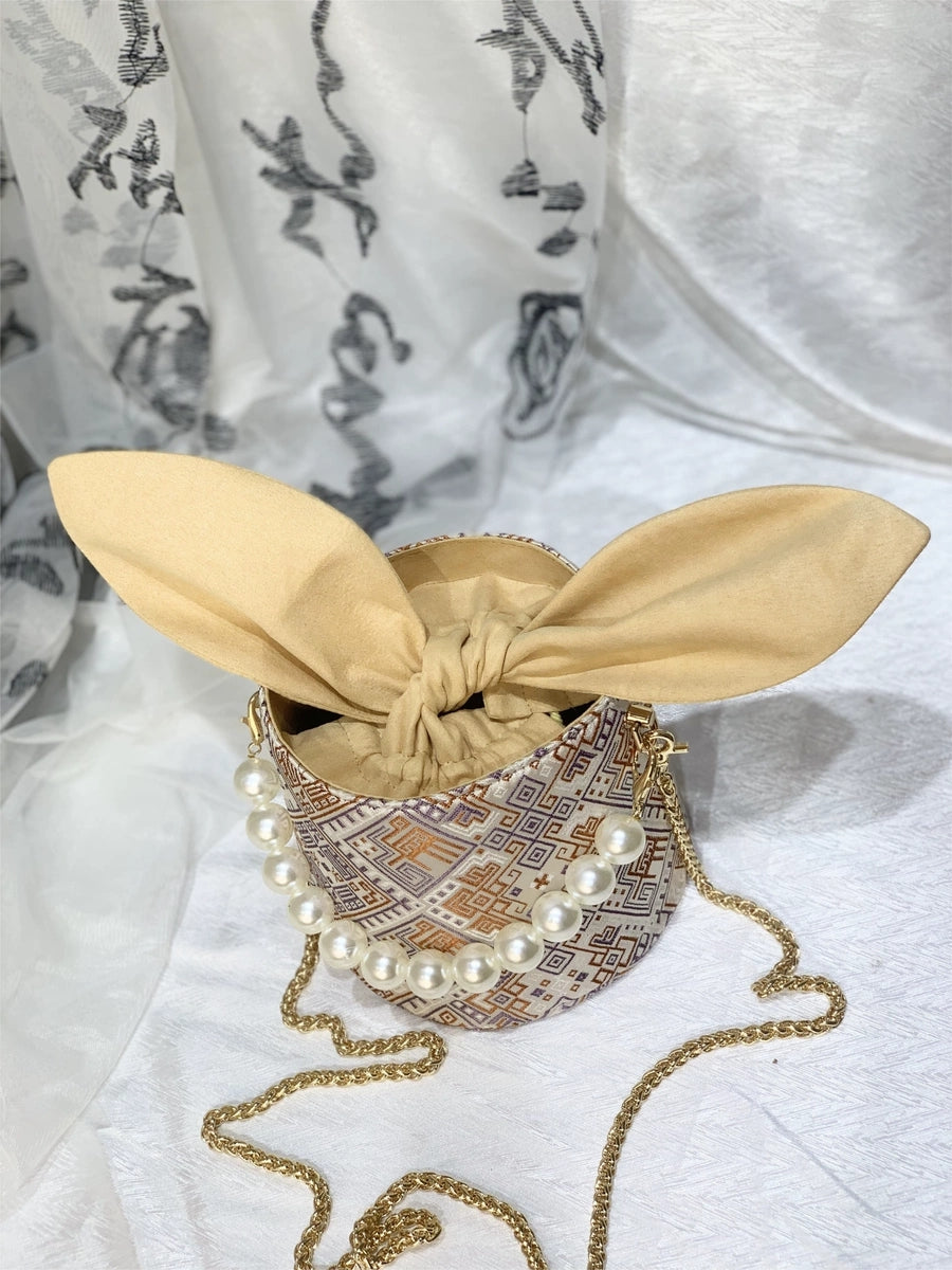 Handmade Zhuang Brocade Bunny-Ear Bucket Bag | Artisan-Crafted Ethnic Crossbody Bag with Pearl Accent