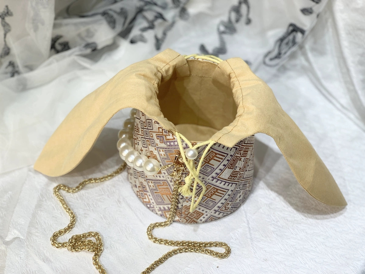 Handmade Zhuang Brocade Bunny-Ear Bucket Bag | Artisan-Crafted Ethnic Crossbody Bag with Pearl Accent