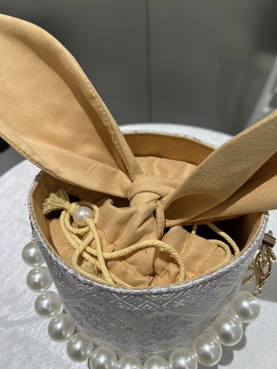 Handmade Zhuang Brocade Bunny-Ear Bucket Bag | Artisan-Crafted Ethnic Crossbody Bag with Pearl Accent