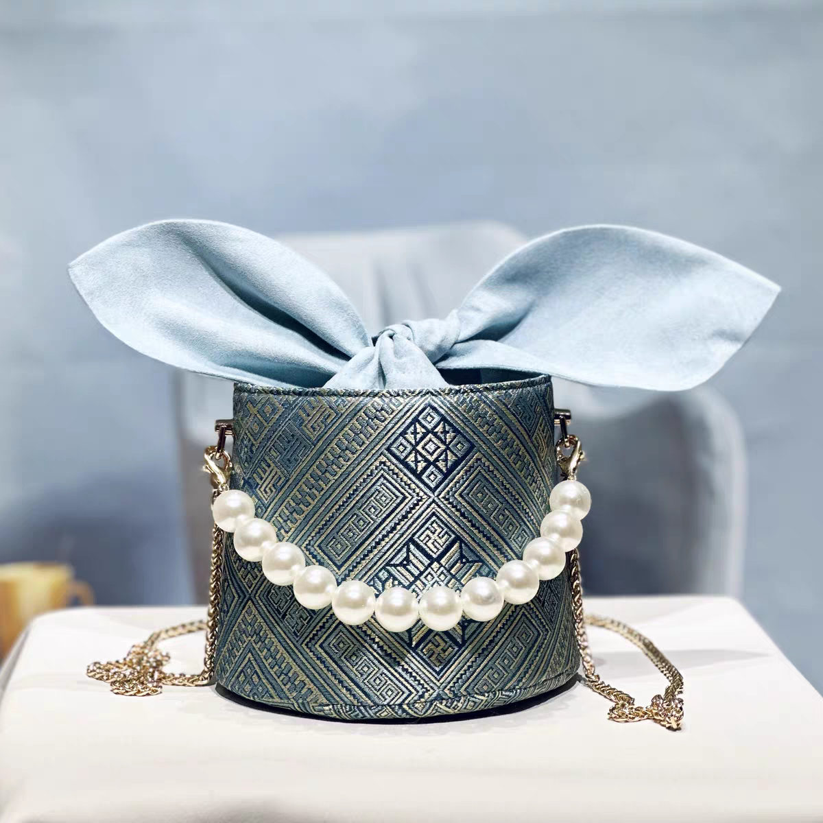 Handmade Zhuang Brocade Bunny-Ear Bucket Bag | Artisan-Crafted Ethnic Crossbody Bag with Pearl Accent